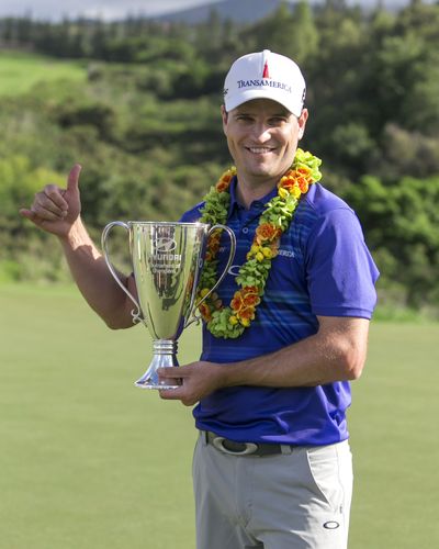Zach Johnson celebrates after claiming a one-shot victory at the Tournament of Champions in Kapalua, Hawaii