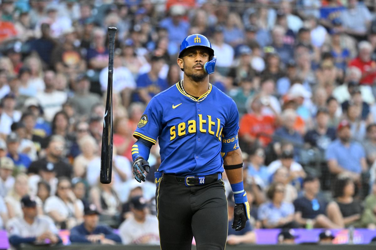 Seattle’s Julio Rodriguez flips his bat after an out during the third inning against the Houston Astros at T-Mobile Park on Friday in Seattle. The Astros won 3-0.  (Alika Jenner)