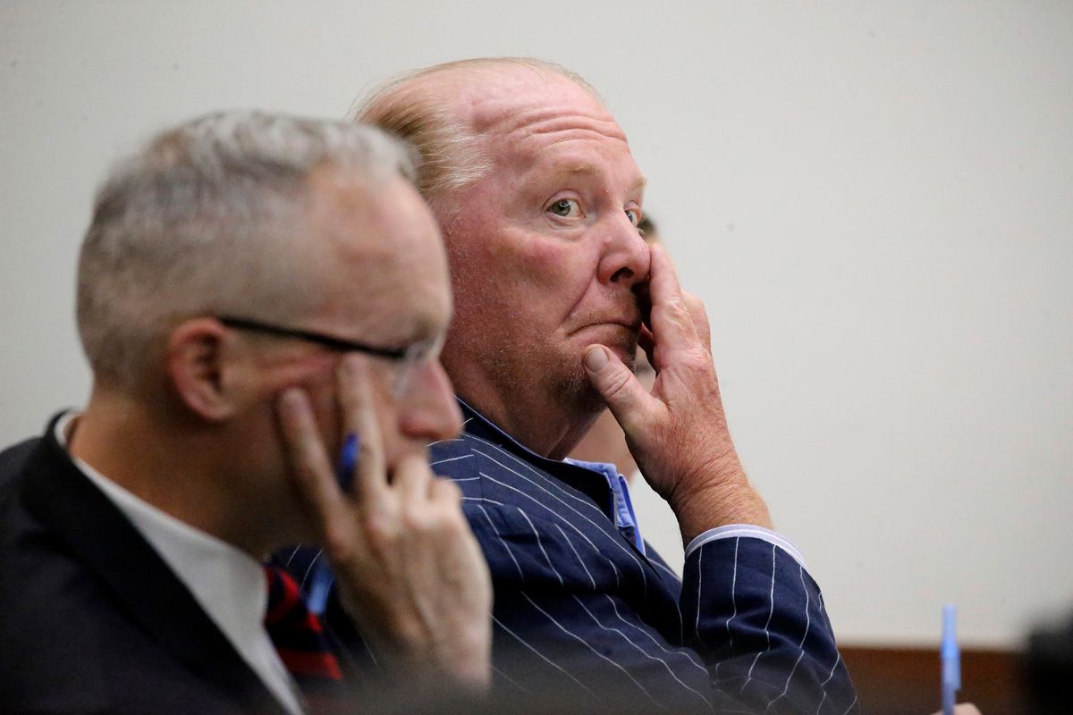 Celebrity chef Mario Batali listens during testimony at Boston Municipal Court on the second day of his sexual misconduct trial on Tuesday, May 10, 2022 in Boston. Batali pleaded not-guilty to a charge of indecent assault and battery in 2019, stemming from accusations that he forcibly kissed and groped a woman after taking a selfie with her at a Boston restaurant in 2017.  (Stuart Cahill)