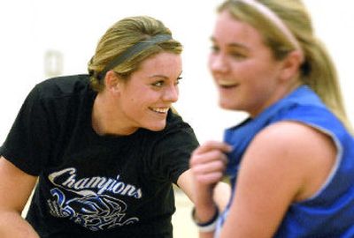 Jenna DeLong, left, and Lindsey Stark, share a laugh – something they do often – during basketball practice at Coeur d'Alene High School on Tuesday.
(Kathy Plonka / The Spokesman-Review)