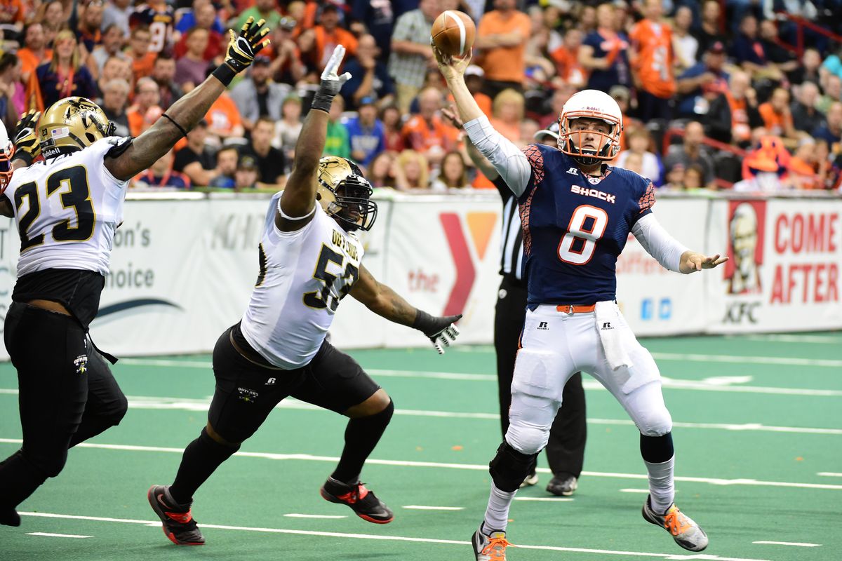 Shock quarterback Warren Smith passes against the Outlaws on Friday night at the Arena. (Tyler Tjomsland)