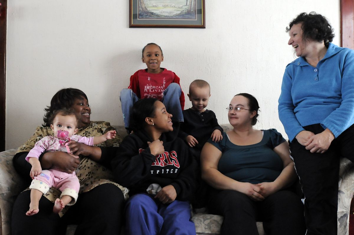 Karen Fournier, far right, sits with Sandra Williams, far left, the house manager for Hearth Homes, two of their residents, Tabitha Allen, center, and her children Zekia, 11 months, and Nicole, 7, in back, and Mandy McGhee, second from right, and her son Kaden Hildebrandt, 3, at Hearth Homes, a women and children’s housing facility in Northeast Spokane. Fournier was a drug addict and was homeless as a much younger person and started Hearth Homes on her own. the Spokesman-Review (Jesse Tinsley the Spokesman-Review / The Spokesman-Review)