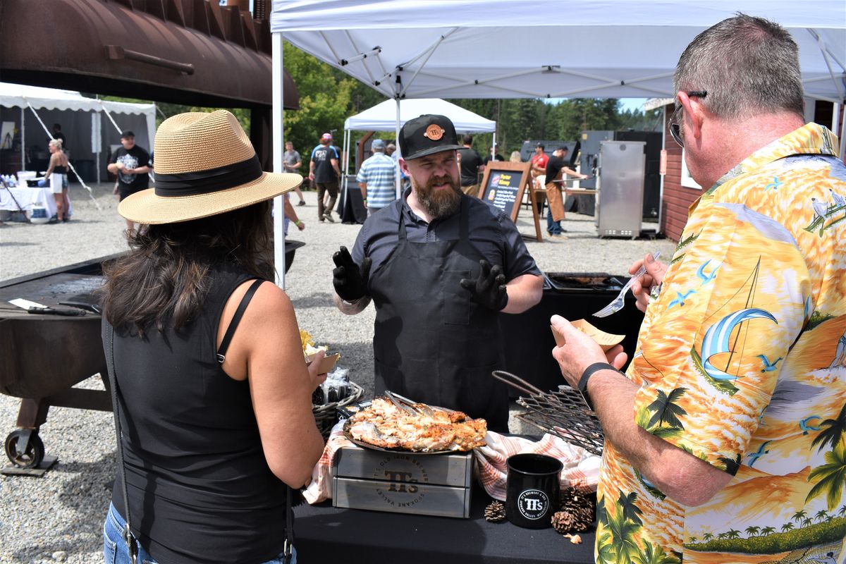 Spokane chef and restaurateur Chad White explains his preparation of salmon to attendees at From the Ashes Idaho in Post Falls on Saturday afternoon.  (Don Chareunsy/The Spokesman-Review)