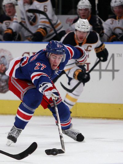 Ryan McDonagh (27) reaches for the puck Saturday during the second period of New York’s win over Buffalo. (Associated Press)