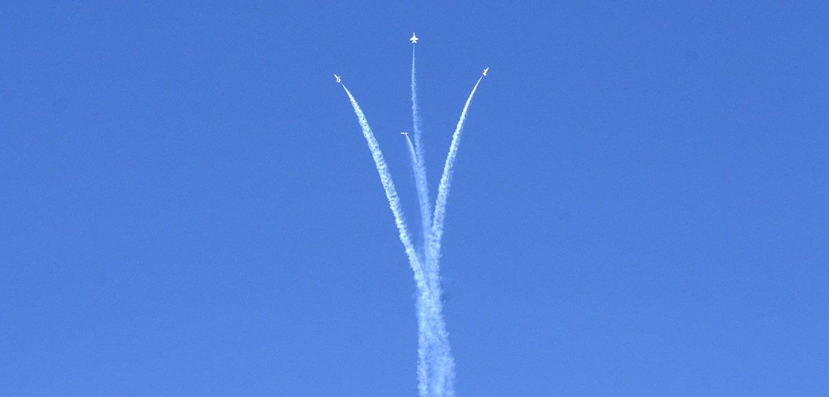 Air Force Thunderbirds trail smoke as they bank over the Nellis Air Force Base golf course. (Christopher Anderson)