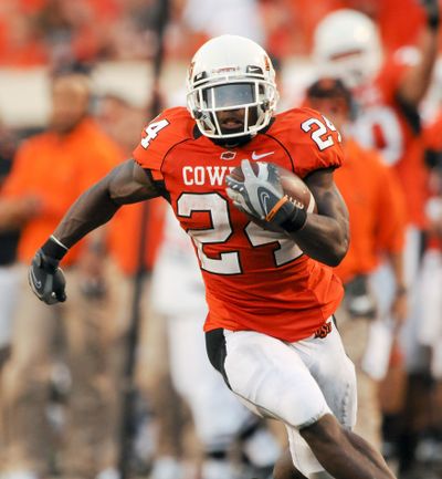 Oklahoma State running back Kendall Hunter breaks away for a 66-yard run in the first half.  (Associated Press)
