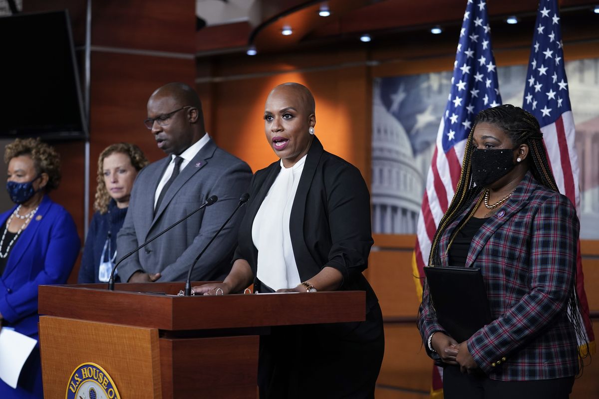 Rep. Ayanna Pressley, D-Mass., tells reporters she is introducing a resolution to strip Rep. Lauren Boebert, R-Colo., of her committee assignments for repeatedly making anti-Muslim remarks aimed at Rep. Ilhan Omar, D-Minn., at the Capitol in Washington, Wednesday, Dec. 8, 2021. She is joined by, from left, Rep. Barbara Lee, D-Calif., Rep. Debbie Wasserman Schultz, D-Fla., Rep. Jamaal Bowman, D-N.Y., and Rep. Cori Bush, D-Mo.  (J. Scott Applewhite)