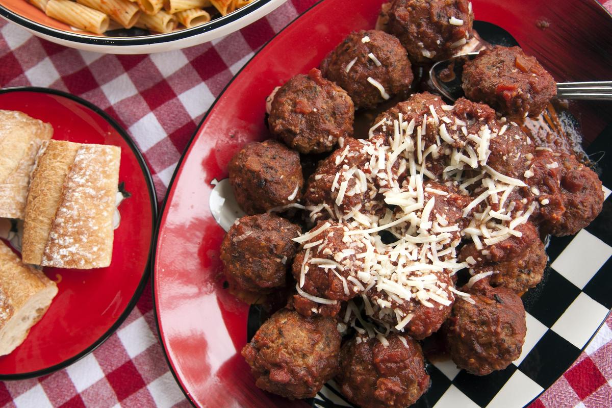 Karen Polello-Frogner bakes her meatballs for about a half hour, then finishes them on the stovetop in her scratch-made tomato sauce. (Adriana Janovich / The Spokesman-Review)