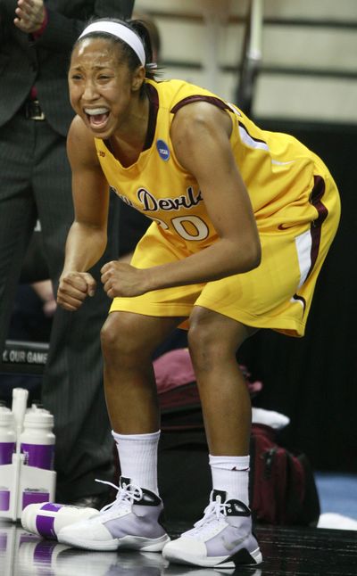 Briann January exhorts her teammates.  (Associated Press / The Spokesman-Review)