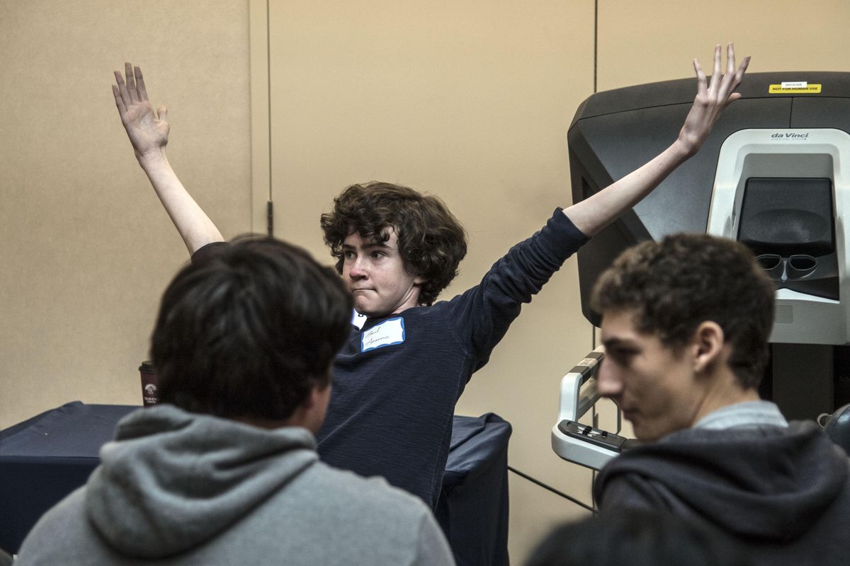 Paul Ausems, a senior at Lewis and Clark High School, celebrates his score of 89.0 on the da Vinci Xi robotic surgery machine, Nov. 4, 2016, at the Rockwood Health System’s Deaconess Hospital hosted event for STEM students at Washington State University’s Spokane South Campus Facility. Area students were introduced and had a hands-on experience with robotic surgery methods. Doctors need a score of 90 to proceed during testing. (Dan Pelle / The Spokesman-Review)