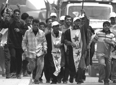 
Supporters of anti-U.S. cleric Muqtada al-Sadr arrive in  Kufa, Iraq, on  Sunday. 
 (Associated Press / The Spokesman-Review)