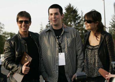 
Contest winner Kevin McCoy, center, is greeted by actors Tom Cruise and Katie Holmes. 
 (Associated Press / The Spokesman-Review)