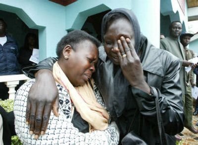 
Sudanese cry in Nairobi, Kenya, on Monday after hearing of the death of John Garang, who led southern Sudanese rebels for 21 years in a war against the Khartoum government, and died in an air crash, only weeks after being sworn in as the country's No. 2 leader in a power-sharing agreement that raised hopes of bringing a lasting peace. 
 (Associated Press / The Spokesman-Review)
