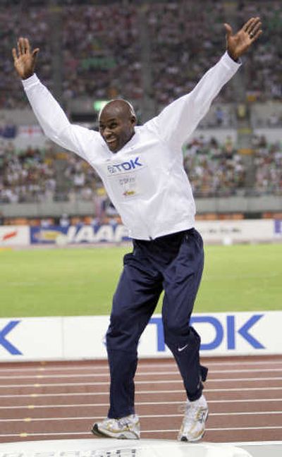 
United States' gold medal winner Bernard Lagat jumps onto the podium during the medal ceremony for the Men's 5,000m on Sunday. Associated Press
 (Associated Press / The Spokesman-Review)