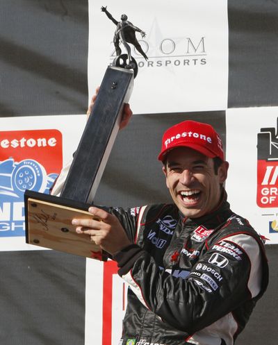 Helio Castroneves held off Scott Dixon to win the first IndyCar race in Alabama. (Associated Press)