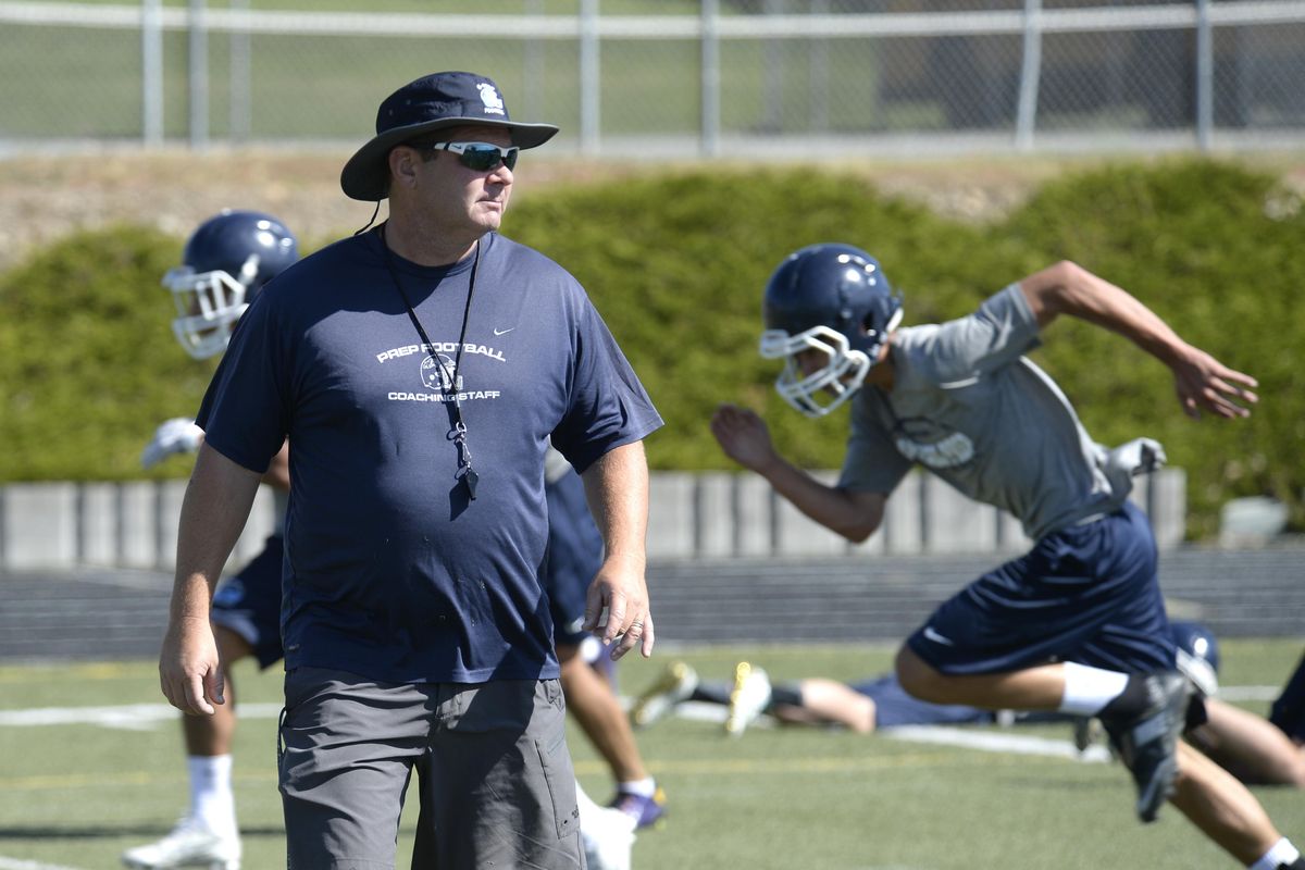 Gonzaga Prep coach Dave McKenna, watching his team on the first day of practice on Aug. 17, says the current Bullpups learned a lot from last year’s championship team. (Jesse Tinsley / The Spokesman-Review)