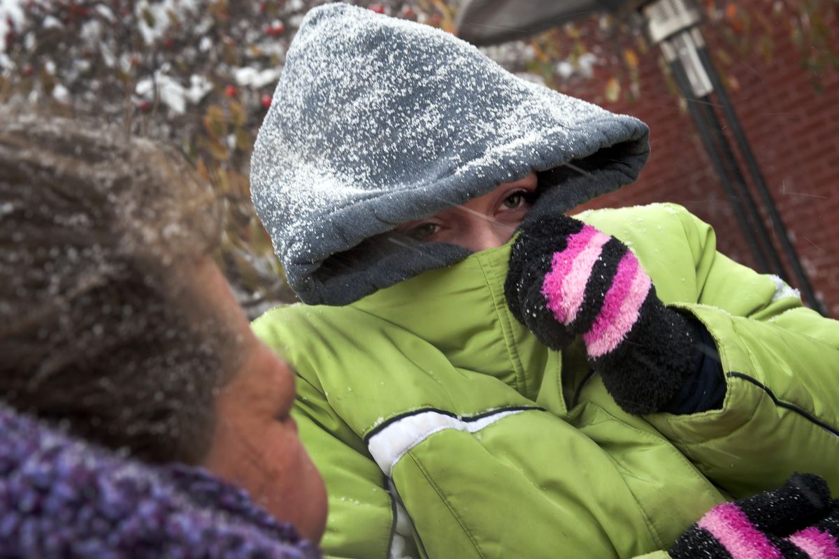 Michelle Lewis braves the bitter cold as she and hundreds of other people lined up outside Salvation Army Tuesday morning, Nov. 23, 2010, to receive a "prepare your own" Thanksgiving dinner. The giveaway will continue until 8 p.m. Tuesday night. (Colin Mulvany / The Spokesman-Review)