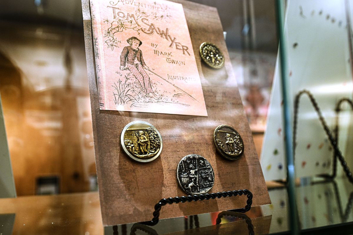 The Historical Button Club’s Tom Sawyer button collection owned by Simone Kincaid is on display at the Coeur d’Alene Library.  (Kathy Plonka / The Spokesman-Review)