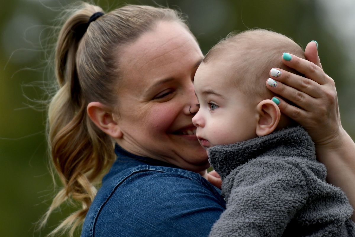Morgan Moss holds her 7-month-old son Jackson on Thursday near her home in Spokane. She has been forced to ask family and friends to keep an eye out for formula due to a nationwide shortage.  (Kathy Plonka/The Spokesman-Review)