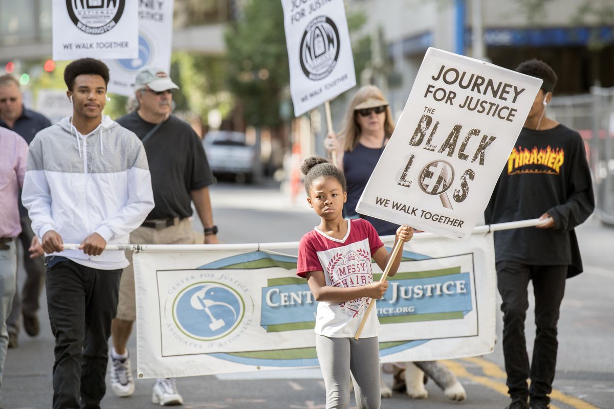 Messiah Lockhart, 8, marches in the Unity in the Community parade Saturday. (SR)