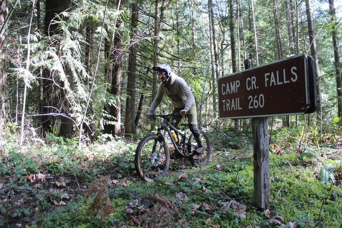 Orogenesis Collective Executive Director Gabriel Tiller rides a trail in the Gifford Pinchot National Forest that, if fully restored, would become part of the Loowit Tier, the first Washington segment of the 5,000-mile Orogenesis mountain bike trail. (Gregory Scruggs/Seattle Times)
