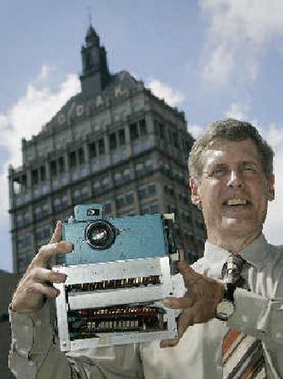 
Steven J. Sasson, Eastman Kodak Co. project manager, holds the prototype digital camera he built in 1975, at Kodak headquarters. 
 (Associated Press / The Spokesman-Review)