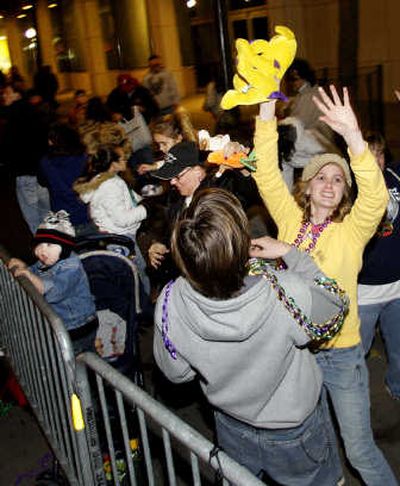 
A paradegoer catches a stuffed animal thrown by the maskers from Order Of Venus group in downtown Mobile, Ala., on Monday. The pre-Lenten blowout continues along the Gulf Coast culminating in Fat Tuesday, or Mardi Gras, celebrations Tuesday. Associated Press
 (Associated Press / The Spokesman-Review)