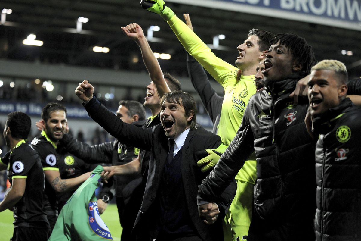 Chelsea’s manager Antonio Conte, center, celebrates with players after the English Premier League soccer match between West Bromwich Albion and Chelsea, at the Hawthorns in West Bromwich, England, Friday, May 12, 2017. Chelsea won the match 0-1 meaning they win the Premier League title. (Rui Vieira / Associated Press)