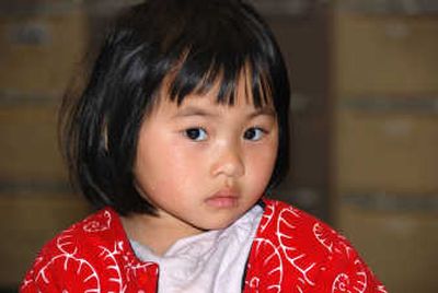 
Qian Xun Xue, 3, was found abandoned at the Southern Cross train station in Melbourne, Australia, on Saturday. Police in New Zealand have been unable to locate her mother while Australian police are tracking her father, who boarded a flight to the United States.Associated Press
 (Associated Press / The Spokesman-Review)