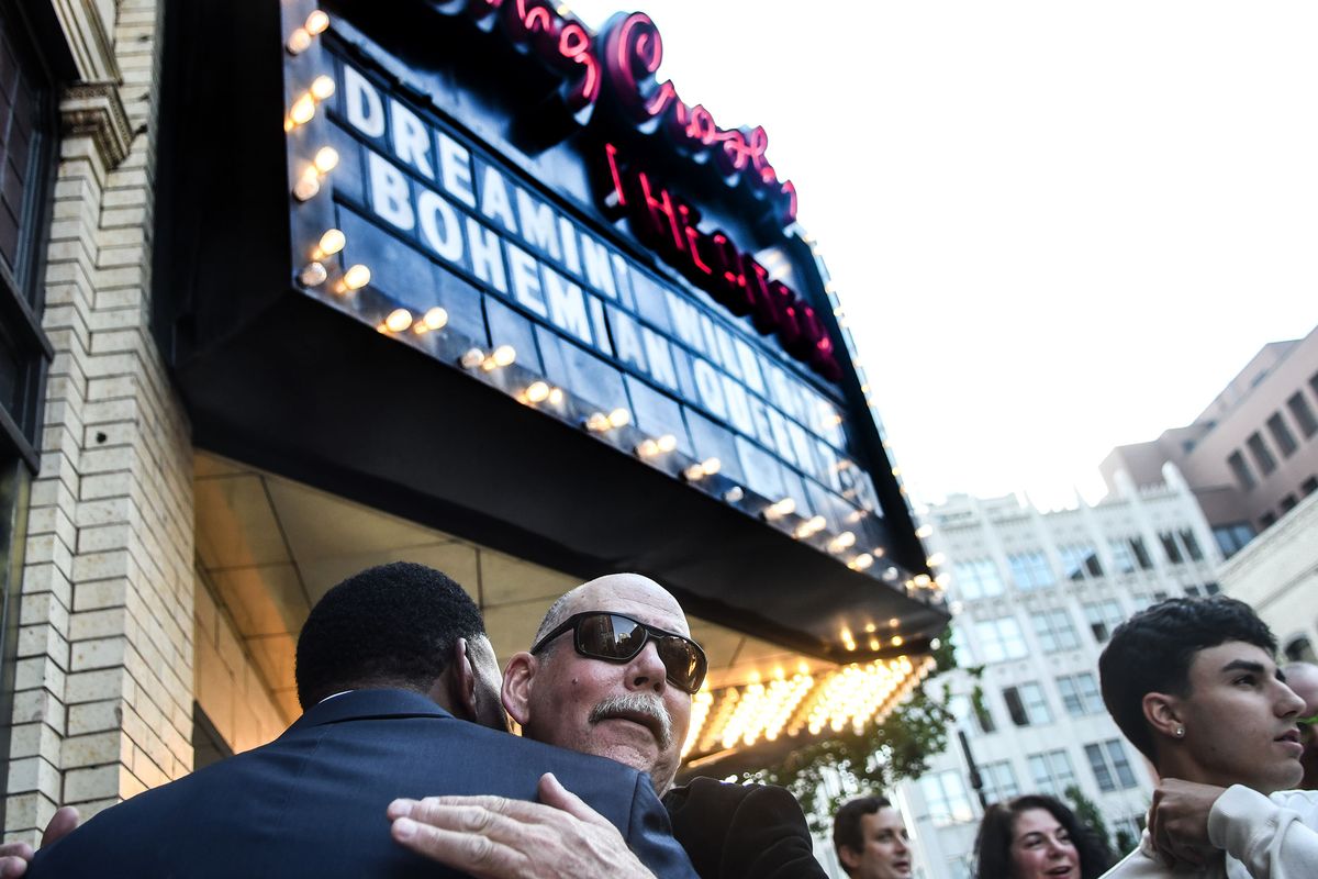 Joe Emerson gets a hug before the screening of “Dreamin’ Wild” at the Bing Crosby Theater in Spokane on Thursday. The film is about Joe and his brother, Donnie, and their dream of making it big in the music industry.  (Kathy Plonka/The Spokesman-Review)