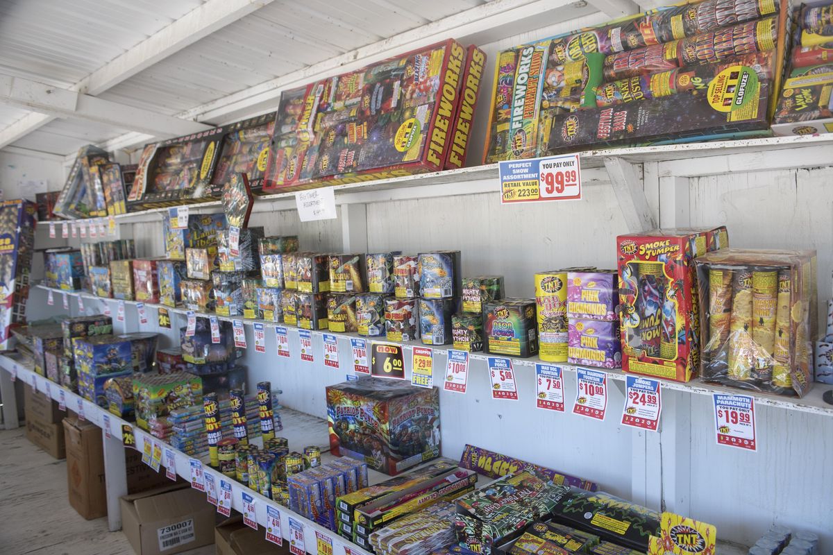 So-called safe and sane fireworks, including fountains, sparklers, Roman candles and others are available at this fireworks stand in the Nine Mile area in the Rosauers parking lot, which is in Stevens County. The fireworks are illegal in Spokane County. (Jesse Tinsley / The Spokesman-Review)