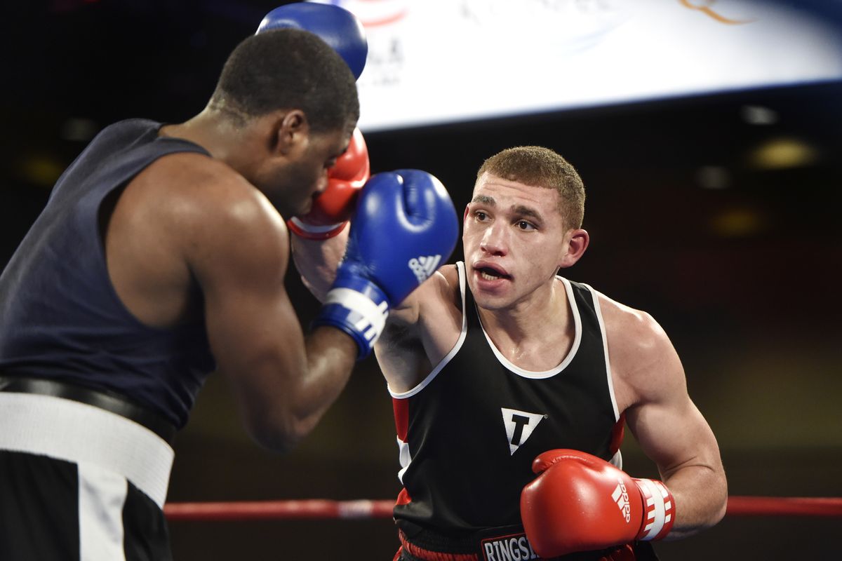 Lewis and Clark grad Pat Ferguson lands a straight right on Kato Montgomery in a semifinal bout Friday. Ferguson won by TKO at 2:15 of the third round. (Tyler Tjomsland)