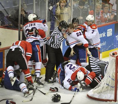 Spokane Chiefs and Portland Winterhawks brawl near the end of the second period Sunday, Jan. 22, 2012, in the Spokane Arena. Multiple game misconducts and penalties for both teams were handed out. (Colin Mulvany / The Spokesman-Review)