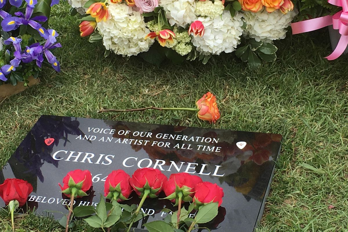 Flowers adorn the grave marker for musician Chris Cornell at the Hollywood Forever Cemetery on Friday, May 26, 2017, in Los Angeles. Cornell, 52, who gained fame as the lead singer of the bands Soundgarden and Audioslave, died at a hotel in Detroit last week. (Sandy Cohen / Associated Press)