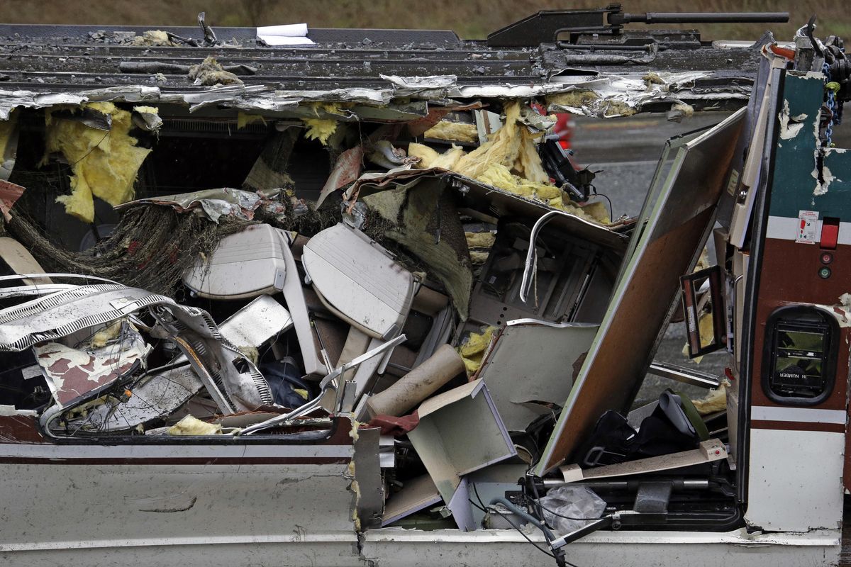 Seats are jammed together with other debris on an upside-down Amtrak train car sitting on a flat bed trailer taken from the scene of Monday's deadly crash onto Interstate 5 Tuesday, Dec. 19, 2017, in DuPont, Wash. The Amtrak train that plunged off an overpass south of Seattle was hurtling 50 mph over the speed limit when it jumped the track, federal investigators said. (Elaine Thompson / Associated Press)
