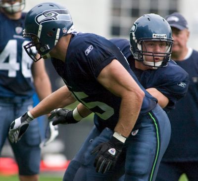 John Carlson, right, may become the first rookie tight end in Seattle Seahawks history to start an opener.  (Associated Press / The Spokesman-Review)