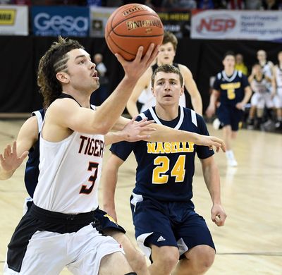 Odessa guard Camden Weber  heads to the basket as Naselle guard Jimmy Strange  defends during Friday’s State 1B semifinal  in the Spokane Arena. (Colin Mulvany / The Spokesman-Review)