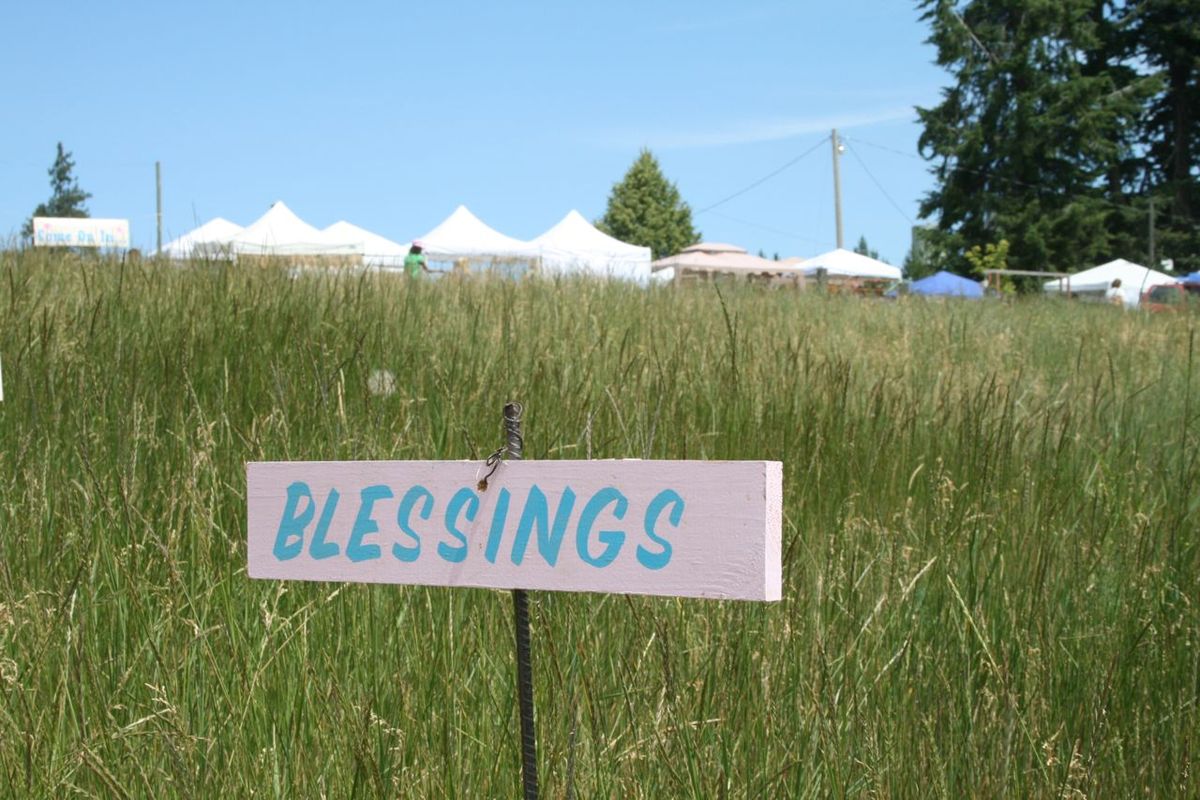 Signs like this one greeted visitors at the Vintage Barn Antique Show in Rathdrum July 11. (Megan Cooley / The Spokesman-Review)