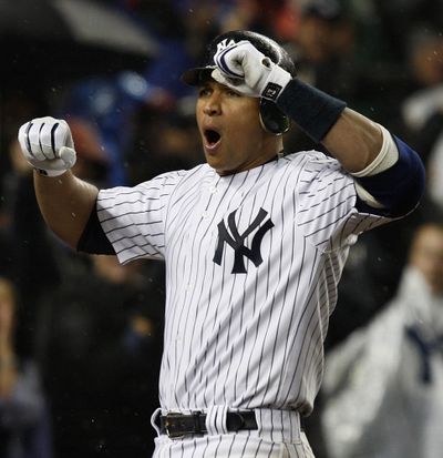 Alex Rodriguez celebrates his game-tying home run in the 11th.  (Associated Press / The Spokesman-Review)