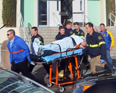 This image provided by the Taft Midway Driller/Doug Keeler shows paramedics transporting a student wounded during a shooting Thursday at Taft Union High School in Taft, Calif. Authorities said a student was shot and wounded and another student was taken into custody. (Associated Press)