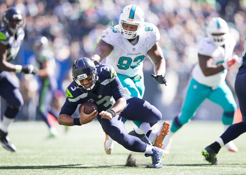 Seattle quarterback Russell Wilson goes down with a sprained ankle when Miami defensive tackle Ndamukong Suh  stepped on Wilson’s foot in the third quarter Sunday.
of an NFL football game in Seattle, Sunday, Sept. 11, 2016. (Dean Rutz/The Seattle Times via AP) ORG XMIT: WASET101 (Dean Rutz / Associated Press)