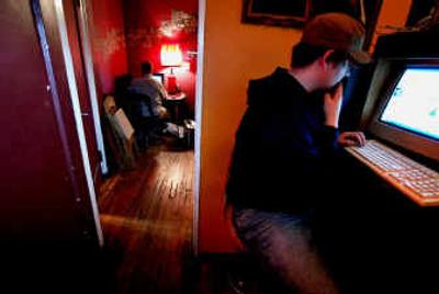 
Josh Inman, right, works on sending an email at Alt.Coffee internet cafe in the East Village, New York on Monday.
 (Associated Press / The Spokesman-Review)