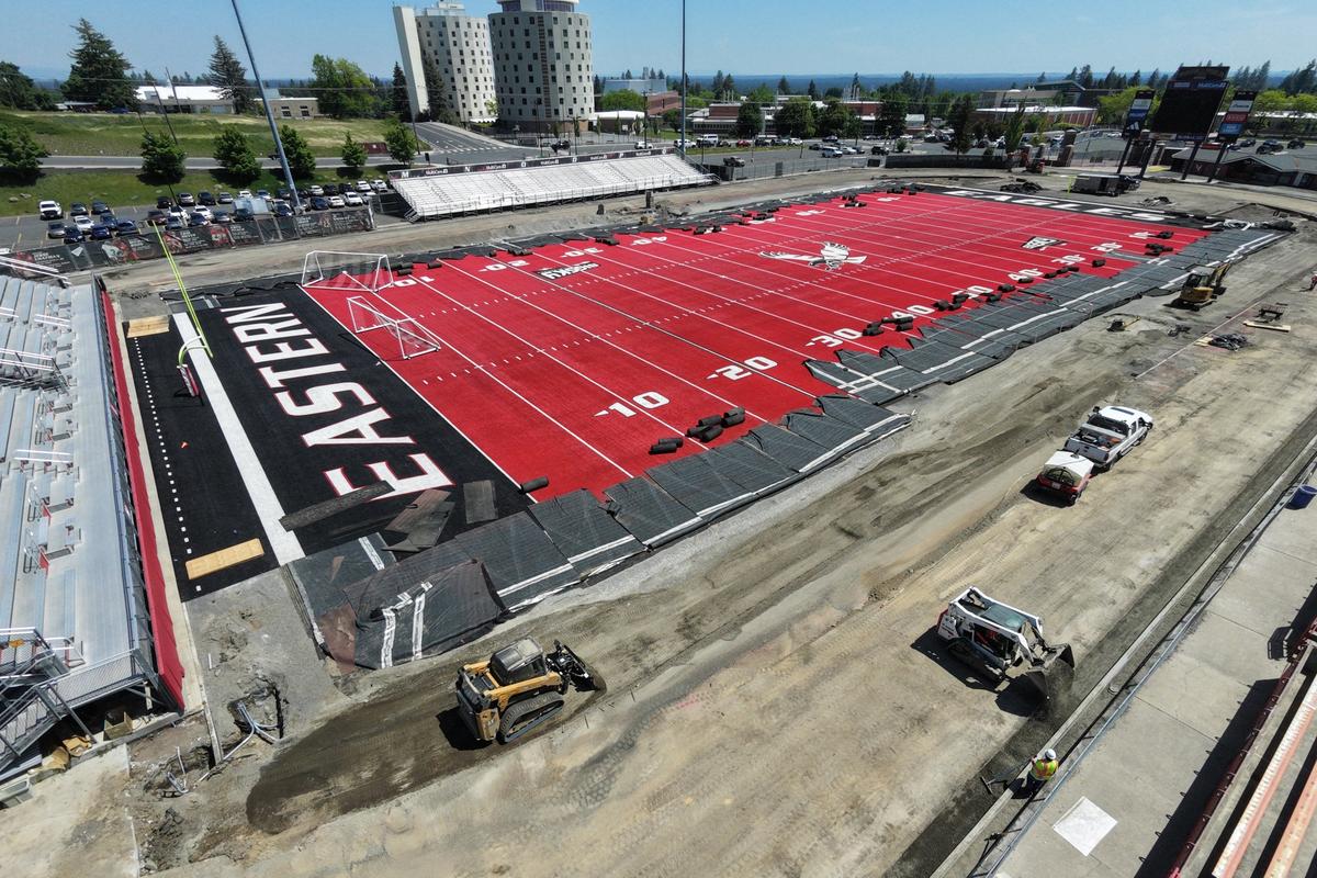 Crews work on resurfacing the track around Roos Field at Eastern Washington University Thursday, May 28, 2026. (Jesse Tinsley/THE SPOKESMAN-REVI)
