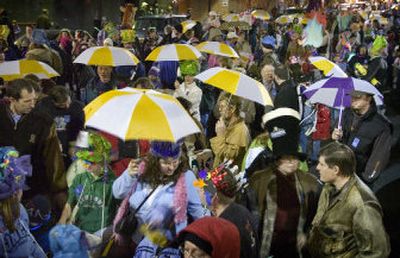 
Hundreds of people wait on Post Street for the Grand Procession to start during First Night, Spokane's New Year's Eve celebration Saturday.
 (Holly Pickett / The Spokesman-Review)