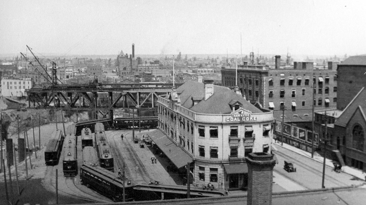 1900s: The Terminal Building stood on the block bounded by Lincoln and Main from 1905 to 1929. It served streetcars and local trains, including the electric train to Coeur d’Alene. It was torn down in 1929 and replaced with a Sears, Roebuck and Co. store.