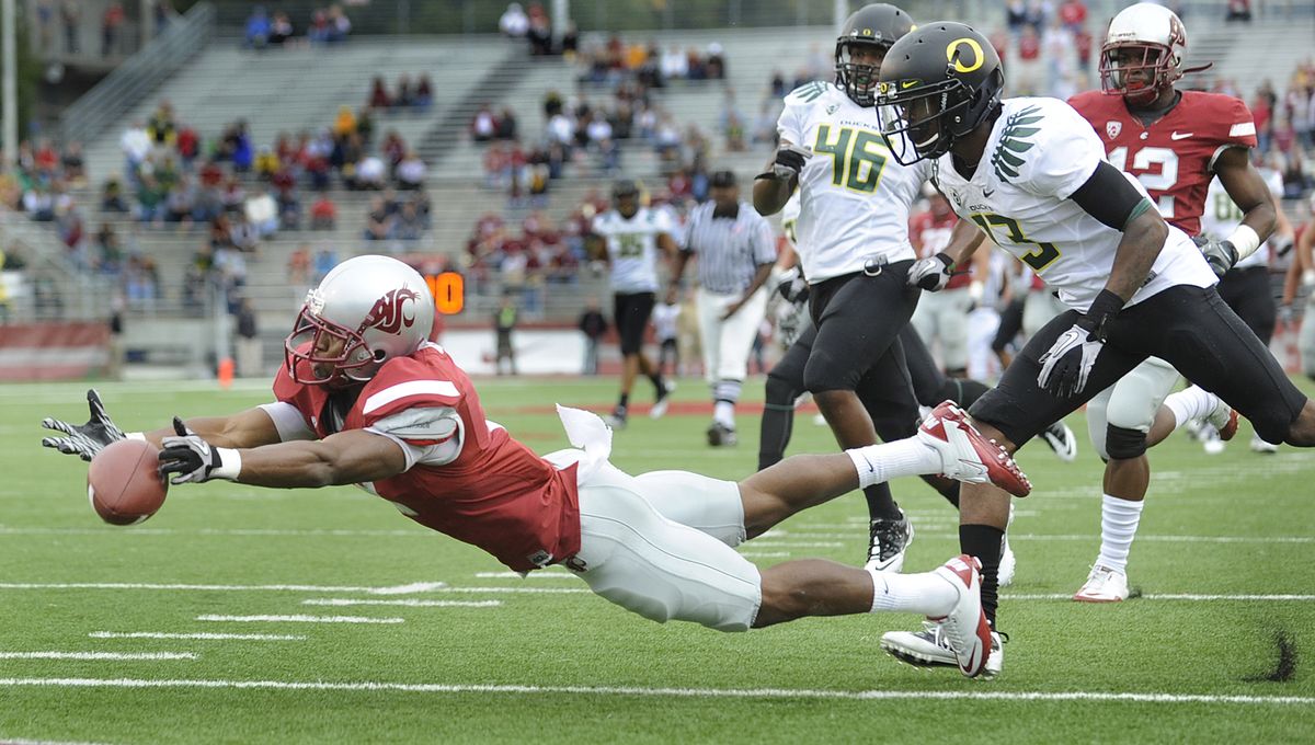 The ball is just off the fingertips of WSU widereceiver Daniel Blackledge as he beats the Oregon defense during their game in Pullman Saturday October 9, 2010. (Christopher Anderson / The Spokesman-Review)