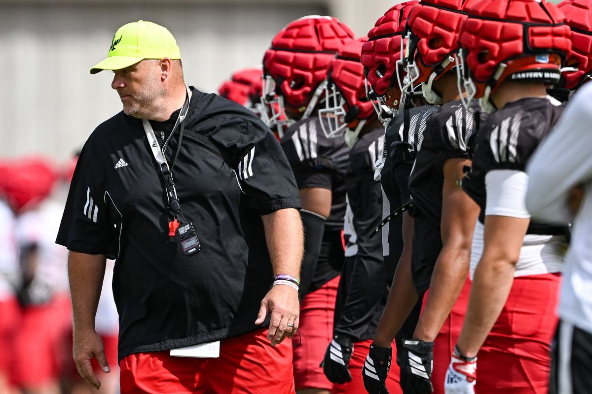 Eastern Washington head coach Aaron Best watches his team during a fall camp practice Tuesday at EWU’s practice field in Cheney. (Tyler Tjomsland/The Spokesman-Review)