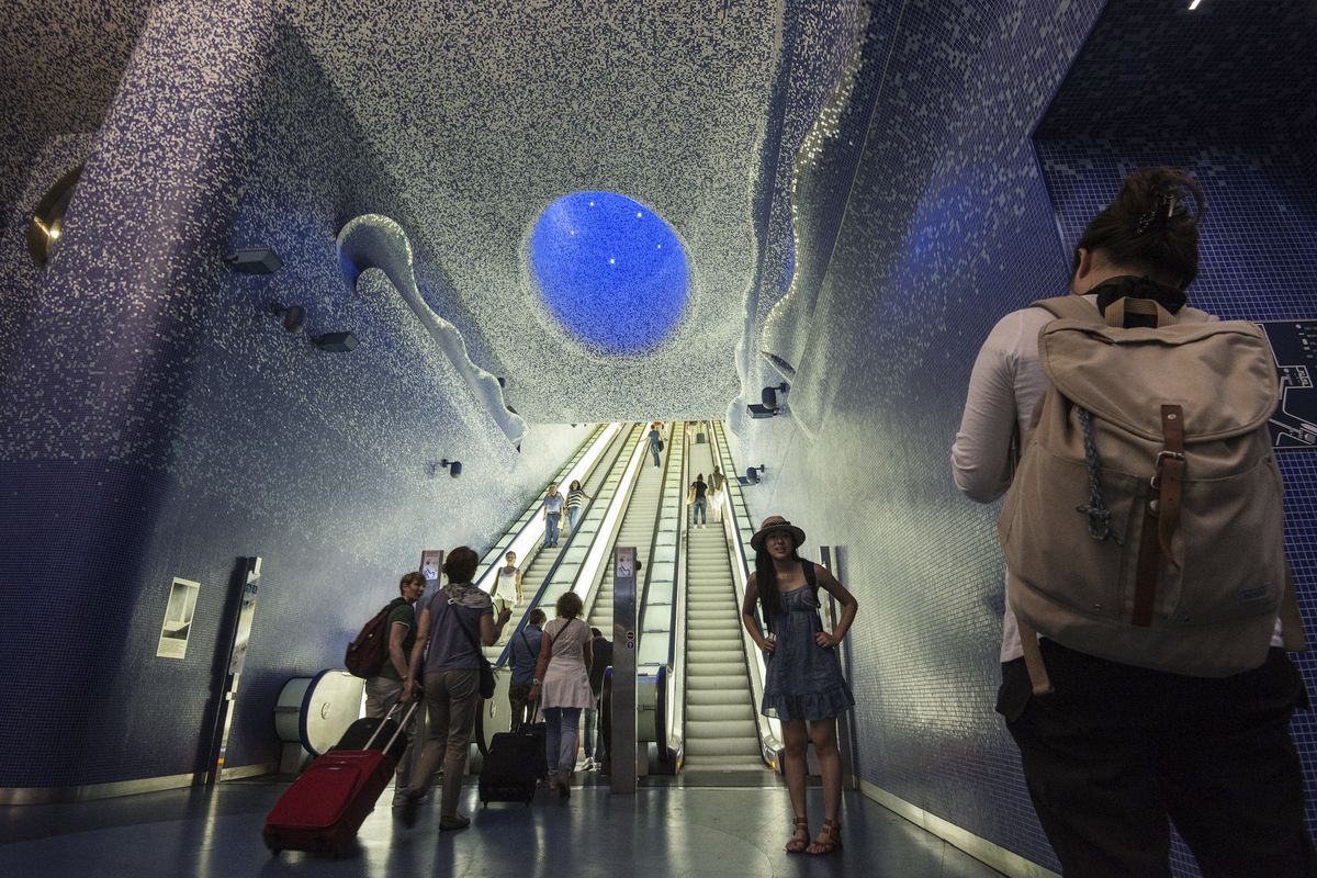 Luca Simeone, left, founder of bike-sharing start up called “bike tour Napoli,” pedals along a cyclists’ path in Naples, Italy.