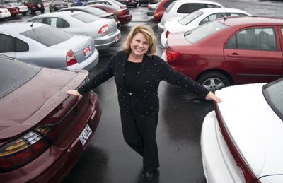 Dealer Jennifer Johnson  says her sales are a bit below normal. “If your financials aren’t solvent, (the economy)  will hit you hard,” she said.   (Colin Mulvany / The Spokesman-Review)