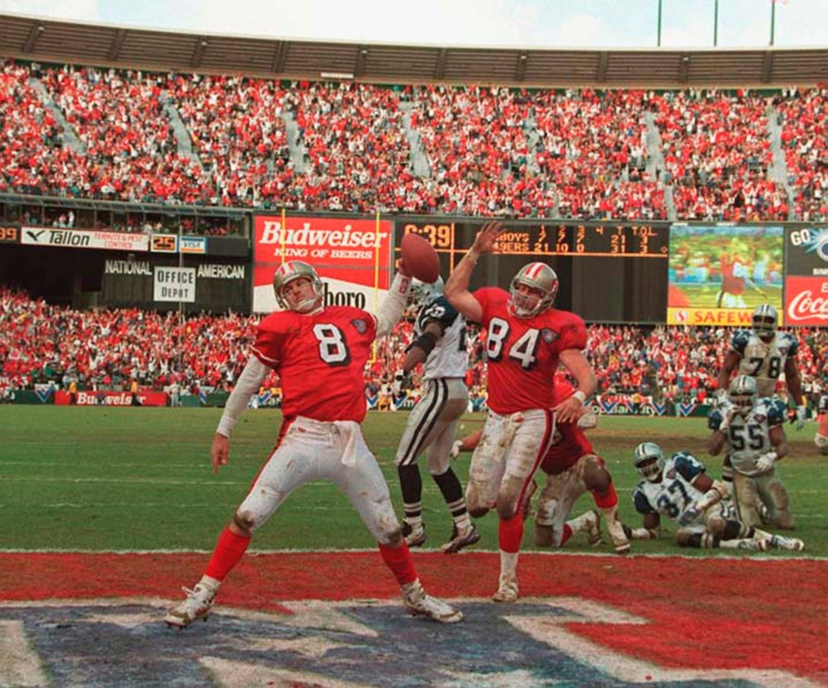 San Francisco quarterback Steve Young spikes the ball in the end zone after his third-quarter touchdown against the Dallas Cowboys in San Francisco in 1995.  (Associated Press)